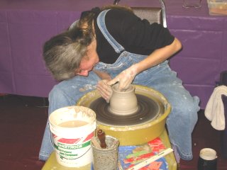 vendor making pottery