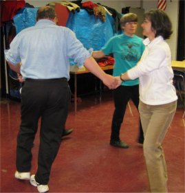 holding hands in a square dancing circle