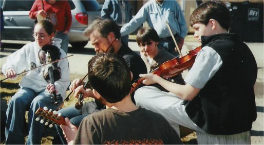 Rachel Eddy, Keith  McManus, and young students jamming out back