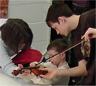 boy touching fiddle