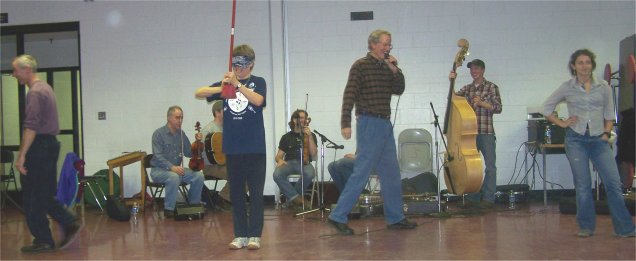 Starting a cake walk at the square dance