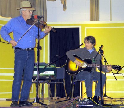 Gerry Milnes playing onstage with Annie Williams after receiving his award